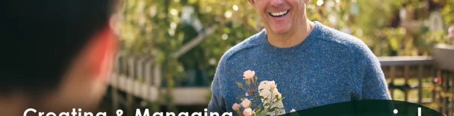 A loyal male customer in a blue sweater holds potted flowers in a garden center. Text: "Creating & Managing Loyalty Programs in Counterpoint" -- a Rapid Garden POS webinar